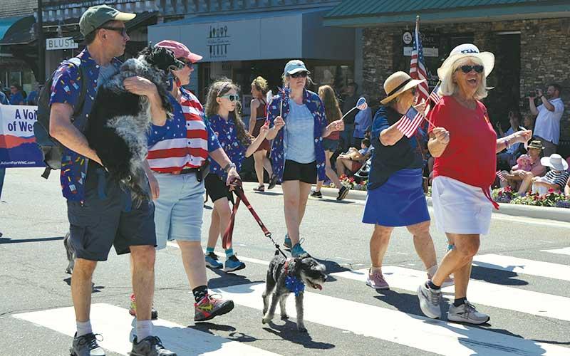 Press photo/Mia Overton - Families and their pets walked in the July 4th parade on Main Street in Franklin.