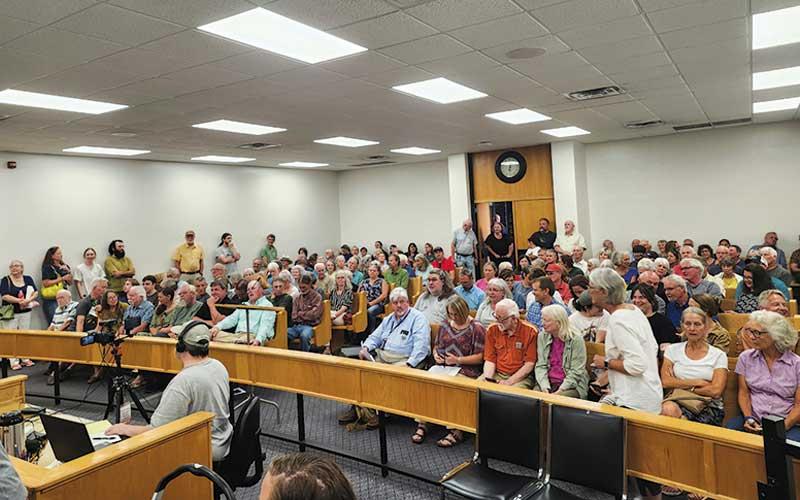 Press photo/Thomas Sherrill - Due to the large number of people attending, the July 9 Macon County Board of Commissioners meeting was moved from the boardroom to the courtroom on the fourth floor of the Courthouse. Thirty-eight people spoke during the public hearings.