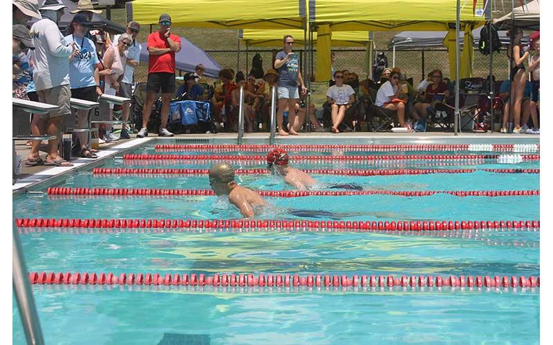 Press photo/Will Woolever - FAST’s Gabriel Ostojic (front) and Thatcher Daniels race to a close finish in the boys 13-14 100-yard breaststroke at the Mountain Swim League Championship meet July 13.