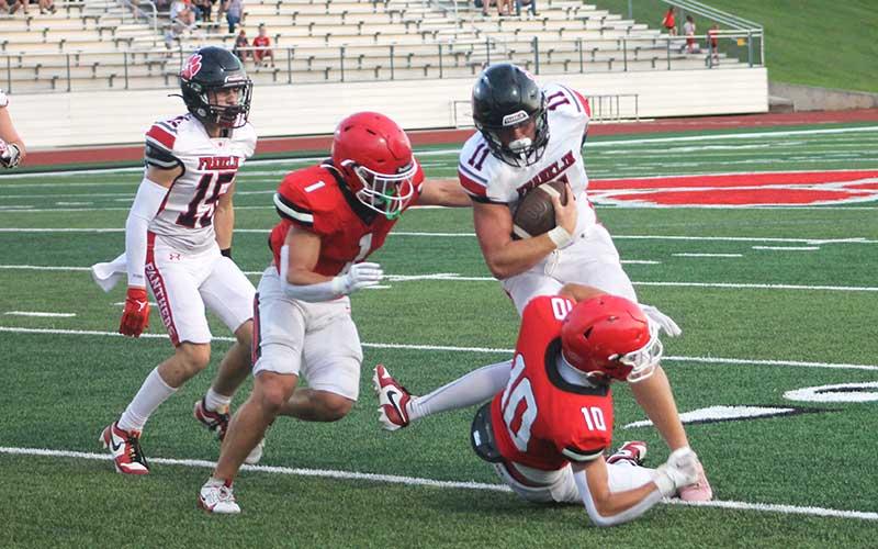 Press photo/Will Woolever - Senior Braydon Hervey bowls over a Wildcat defender in a preseason scrimmage versus Rabun County Aug. 9.