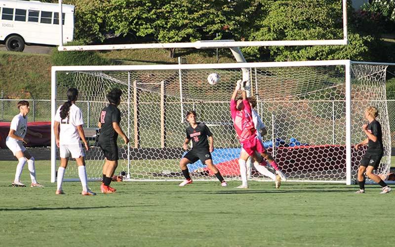Press photo/Will Woolever - Sophomore goalkeeper Ken Modlin punches a ball from danger versus Asheville Aug. 19.