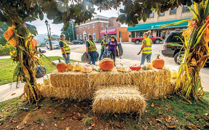 Photo/Bob Scott - Workers from the Town of Franklin and LBJ Job Corps decorating for fall on Main Street.