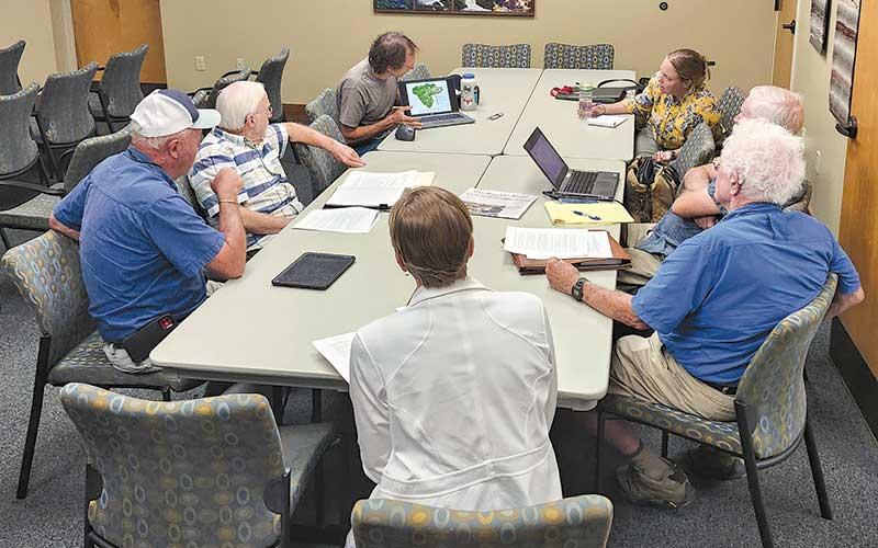 Press photo/Thomas Sherrill - Jason Love (at left with laptop computer) shares a presentation with the Water Quality Advisory Committee during an Aug. 28 meeting.