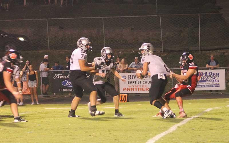 Press photos/Will Woolever - Senior linebacker Avery Carpenter grabs the jersey of Robbinsville’s quarterback behind the line of scrimmage at the Panther Pit Aug. 30.