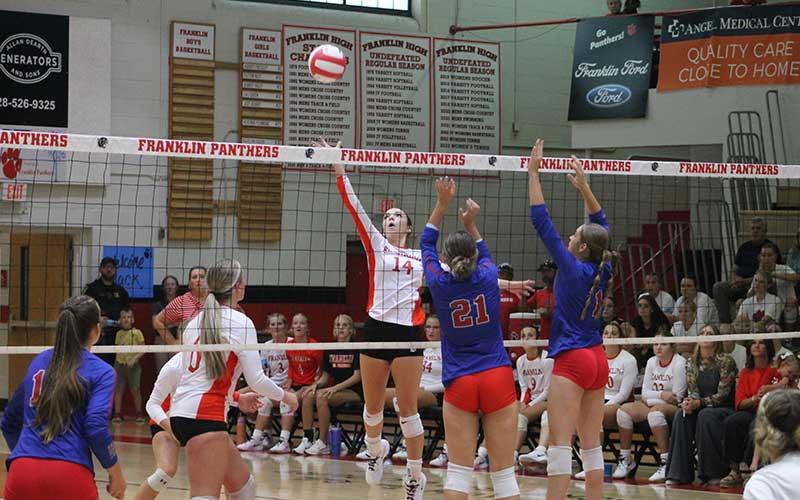 Press photo/Will Woolever - Sophomore Halle Shields lifts a ball over the net versus West Henderson Sept. 10.
