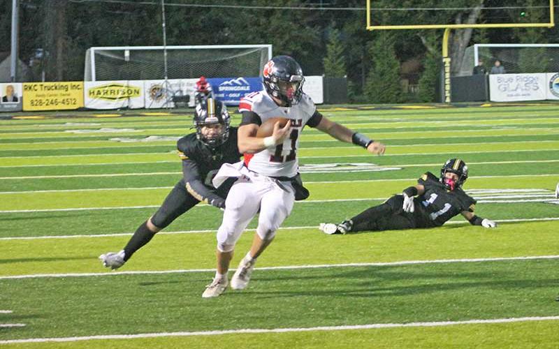Press photo/Will Woolever - Senior Braydon Hervey leaves defenders in his wake at Tuscola Oct. 15.