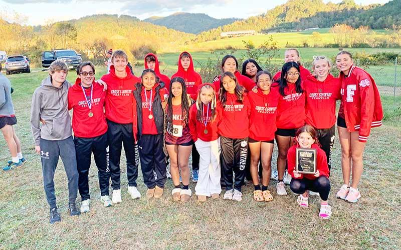 Press photo/Will Woolever - Panther cross country is pictured with their women’s team runner-up plaque after the Mountain Seven Conference Championship meet at the International Paper Sports Complex in Canton Oct. 16.