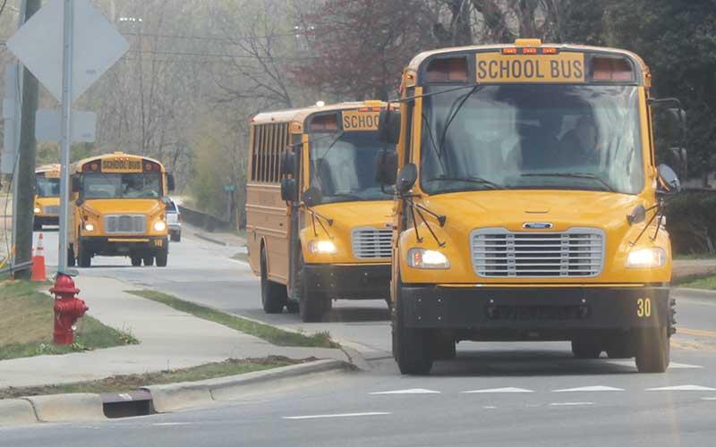 Press file photo - School buses in the Depot Street roundabout.