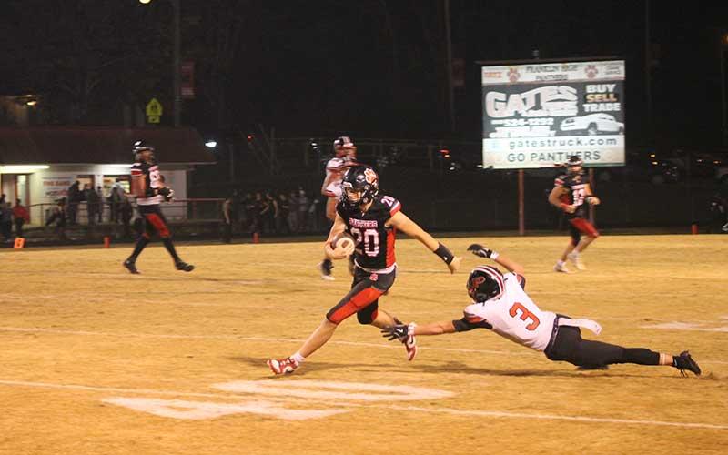 Press photo/Will Woolever - Sophomore Lance Parker slips a tackle in the Panther Pit’s final regular-season game Nov. 1.