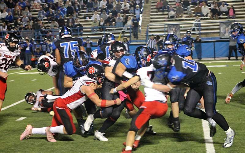 Press photo/Will Woolever - A gang of Panthers tackles a Smoky Mountain ball carrier Nov. 8. From left (wearing white) are Braydon Hervey, Addix Sutton and Talon Smith.