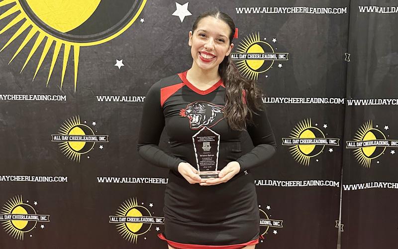 Photo submitted.  Senior Brianne Quiroz is pictured after earning the NCHSAA/Cheersounds Scholarship Dec. 7.