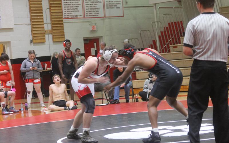 Press photo/Will Woolever.  Senior Avery Carpenter hand-fights with a wrestler from Rabun County Dec. 17.