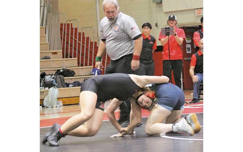Press file photo - Then-junior Malaina Alberry battles a wrestler from Enka on Tom Raby Court last winter.