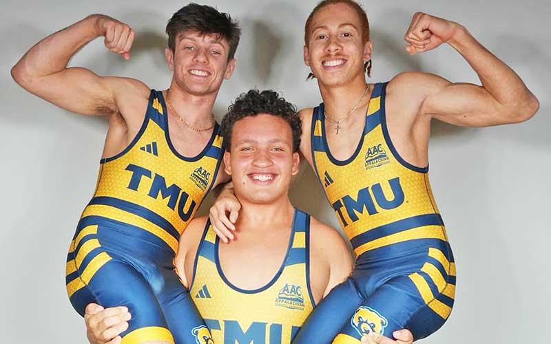 Photo courtesy of Jack Terrell - Former Panther wrestling standout Phillip Terrell (center) is pictured with two Truett-McConnell teammates.