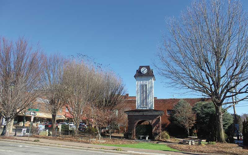 Press photo/Thomas Sherrill - Some of the trees around the clock tower square will soon be cut down because they are creating hazards. The work will be part of the overall improvements to the clock tower and surrounding area.