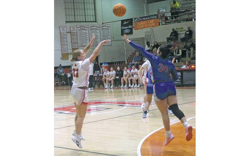 Senior guard McKenna Plemmons attempts a 3-point shot versus West Henderson Jan. 14. (Press photo/Will Woolever)