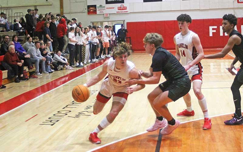 Press photo/Will Woolever - Sophomore Will Rauers drives to the basket versus East Henderson on Tom Raby Court Jan. 21.
