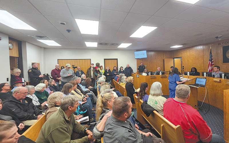 Photo by Thomas Sherrill - A packed house listens to Joanne Rosner speaking to the Macon County Board of Commissioners at the Feb. 11 meeting.