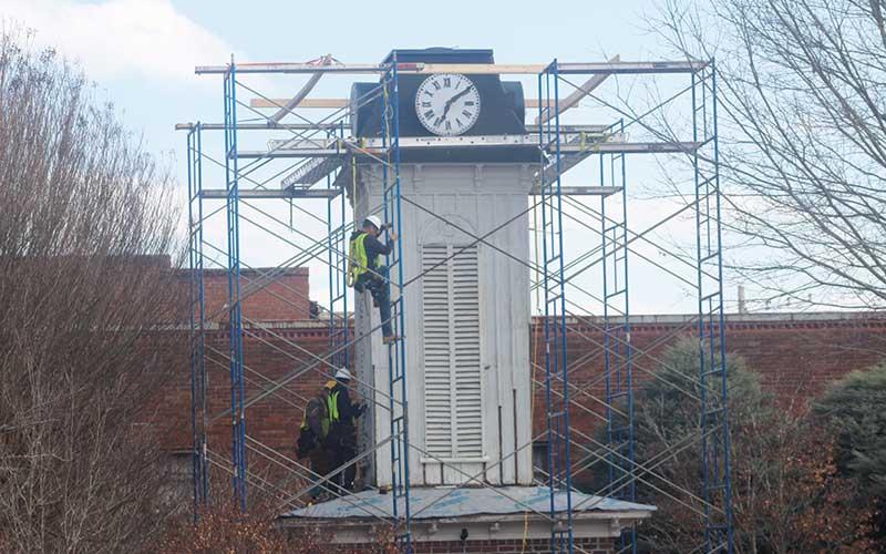 Press photo/Thomas Sherrill - Workers make repairs to the Clock Tower in downtown Franklin on Friday, Feb. 7.