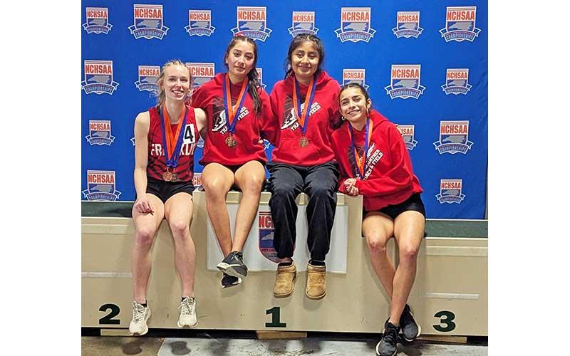 Photo courtesy of Melissa Ward - Franklin’s women’s 4x400-meter relay team is pictured with their third-place medals at the 3A state meet in Winston-Salem Feb. 15. From left are Anna Timan, Michelle Ortega, Amy Mendoza Lopez and Laura Covarrubias.
