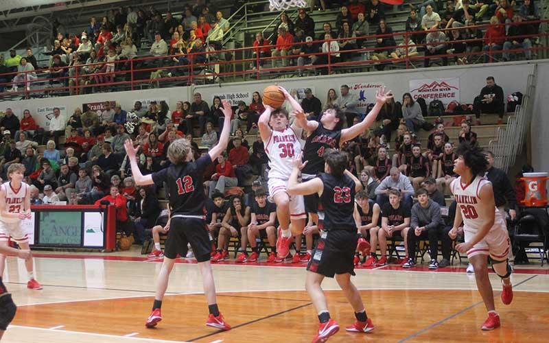 Press photos/Will Woolever - Freshman Paxton Sutton attempts a contested jump shot in the JV men’s final, also versus Pisgah on Tom Raby Court.