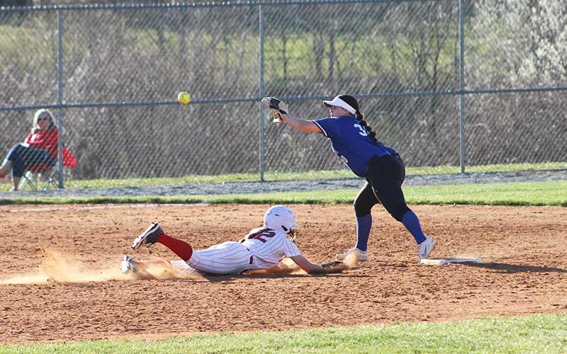 Press photo/Will Woolever - Freshman Suzanna Cabe slides underneath a throw while stealing second base vs.  Hiwassee Dam March 19.