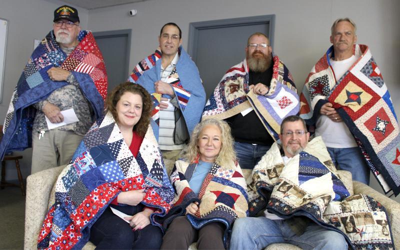 Press photo/Vickie Carpenter. Veterans receiving Quilts of Valor from Smoky Mountain Quilters Guild on March 27. More photos are posted on The Franklin Press Facebook page.