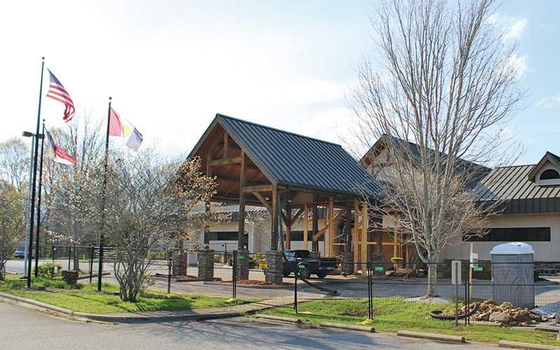 Press photo/Shelby Powell - Repairs continue at the entrance to the Macon County Public Library.