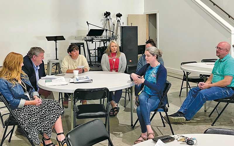 Press photo/Shelby Powell - A collection of Macon County Schools counselors and mental health specialists speak with Ronnie Beale about the need for additional mental health resources in public schools, namely funding and personnel.