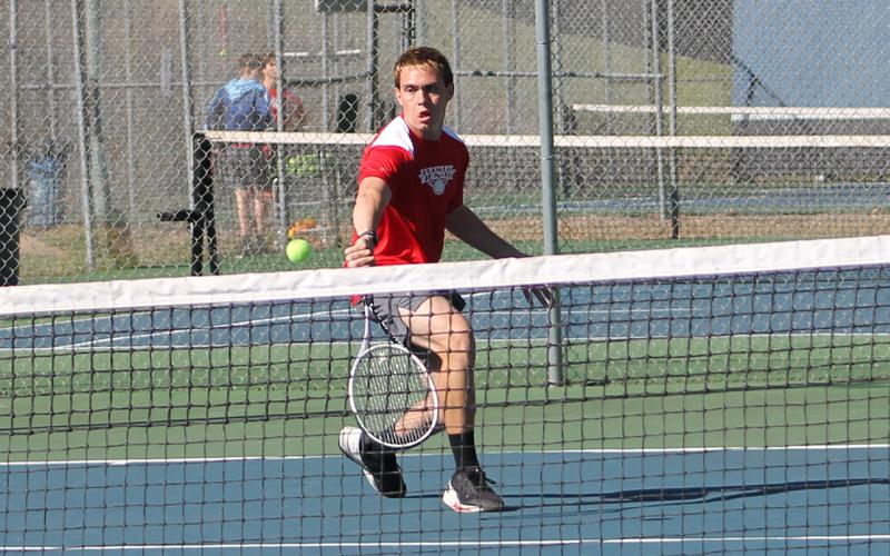 Press photo/Will Woolever. Senior Gavin Rinker hits a groundstroke versus Tuscola March 26.