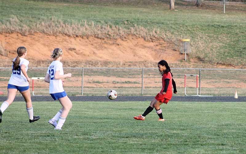 Sophomore Kai Pelletier takes a long-range shot versus Madison March 28. The shot found the net for one of Franklin’s nine goals in the blowout win.