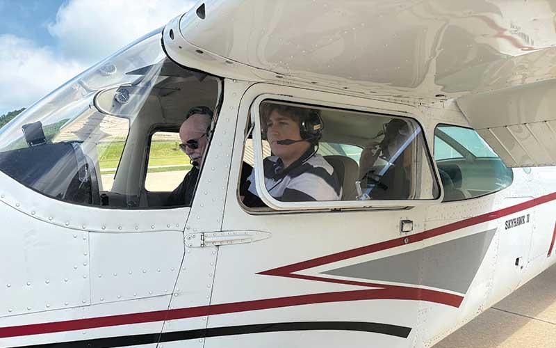 Press photo/Will Woolever - FHS student Myles Bargman in the cockpit as he prepares to take off at the Macon County Airport.