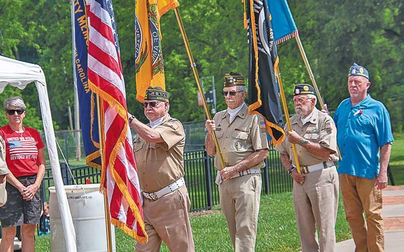 Photo/Bob Scott - Members of the American Legion and Veterans of Foreign Wars Honor Guard present the colors.