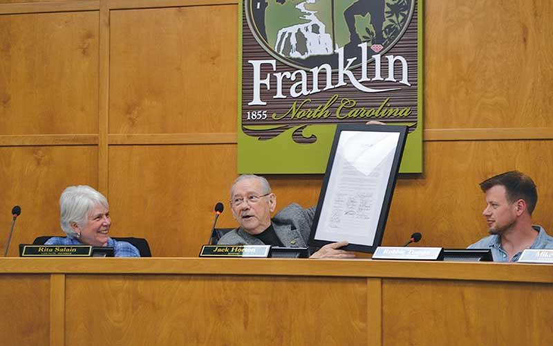 Press photo/Mia Overton - Mayor Jack Horton displays the award the Town of Franklin received for signing the N.C. League of Municipalities “Commit to Civility” pledge. Franklin was the second town to sign the pledge and the first to have 100% participation. As part of the pledge council members attended a two-hour training and passed a resolution to support a civil, respectful and effective approach to local leadership. Also pictured are Town Council members Rita Salain and Robbie Tompa.
