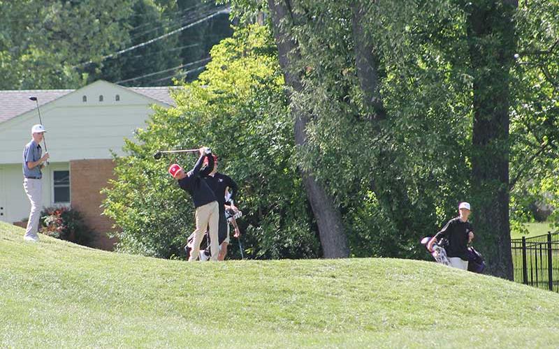 Press photo/Will Woolever - Junior Tanner Jones tees off on Hole #7 at the Waynesville Inn and Golf Club May 6. The ball is visible in the top right corner of the frame.