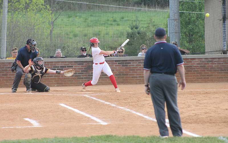 Press file photo - Junior Meliah Mason sends a ball down the third-base line versus Murphy April 21 at Macon Middle School.