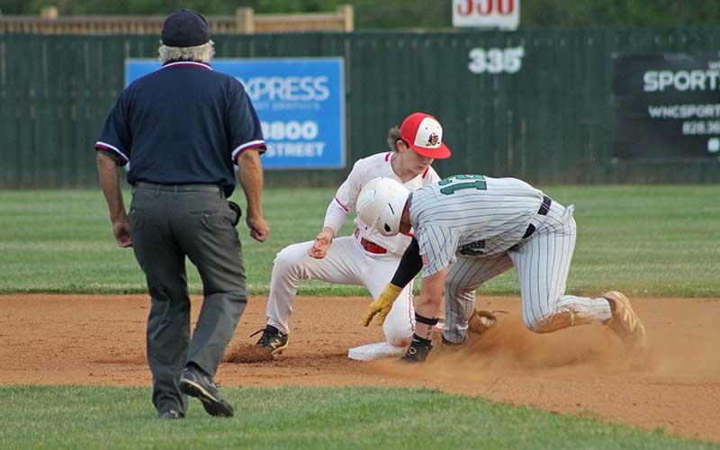 Press photo/Will Woolever - Sophomore Isaiah Deas catches a runner stealing versus East Henderson May 1.