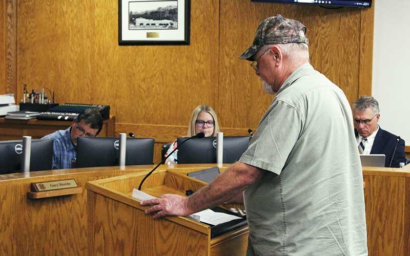Press photos/Shelby Powell - Cullasaja resident Don Willis speaks to the county commissioners, advocating for a one-cent tax increase for the fire district.