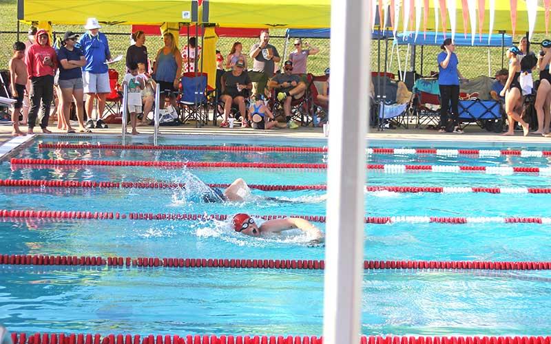 Press photo/Will Woolever - FAST’s Joel Fausnaugh (foreground) races Jackson County’s Cail Lord-Siler to a photo finish in the boys 11-12 50-yard freestyle June 19.