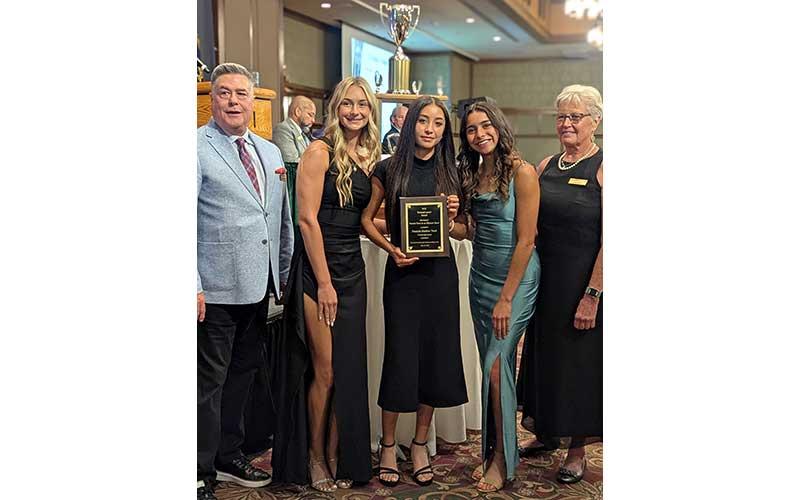 Members of Panther outdoor track and field are pictured with their Division I Female Olympic Sport Team of the Year plaque. From left: Aubrey Haley, Michelle Ortega and Laura Covarrubias.