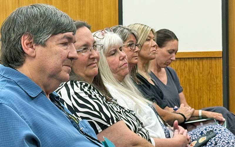 Press photo/Mia Overton - Macon County Health Department staff, including Public Health Director Kathy McGaha (second from left) listen to issues brought up during the joint meeting of the Board of Health and the Macon County Board of Commissioners on July 9.
