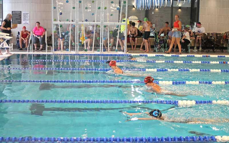Press photo/Will Woolever - FAST’s Madelyn Kennedy (left) and Leila Pinkston (second from bottom) swim a close race in the girls 11-12 50-yard breastroke at the Mountain Swimn League All-Star meet July 19.