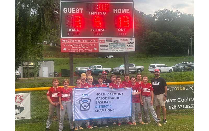 Press photo/Will Woolever - Franklin’s 12U baseball All-Stars show off their District 5 Champion banner after routing Blue Ridge at Parker Meadows July 1.