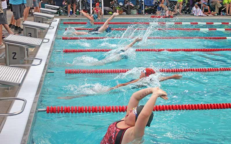 Press photo/Will Woolever - FAST’s Savannah Jessup (foreground) and Naomi Walker compete in the girls 11-12 50-yard backstroke July 3.