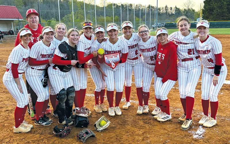 Press file photo - Kendall Rumans is pictured with her Panther softball teammates after breaking the program’s career home runs record versus East Henderson April 8.