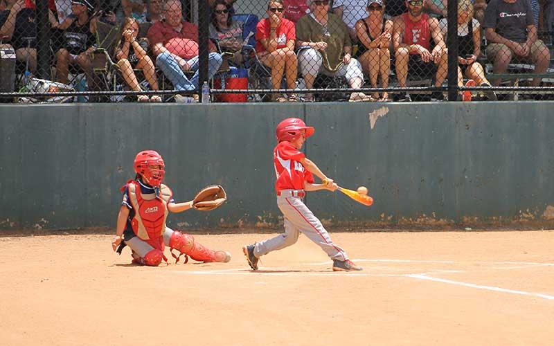 Press photo/Will Woolever - Machine Pitch Baseball’s Brentley Fregeau knocks a single versus North Asheville June 29.