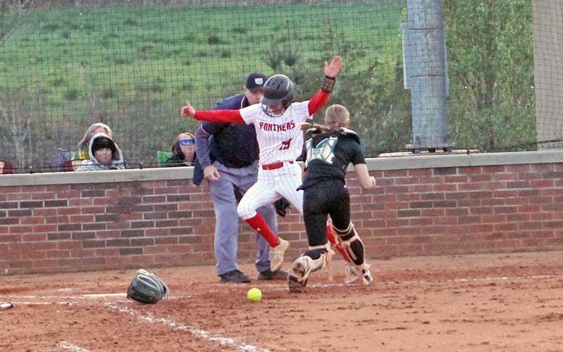 Pendergrass evades a tag at home plate versus East Henderson at Macon Middle School April 8 (Press file photo).