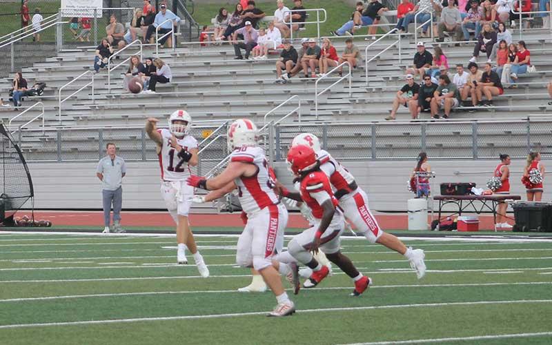 Press photo/Will Woolever - Junior quarterback Anderson Terrell targets senior running back Addix Sutton in Franklin’s preseason scrimmage at Rabun County Aug. 8.