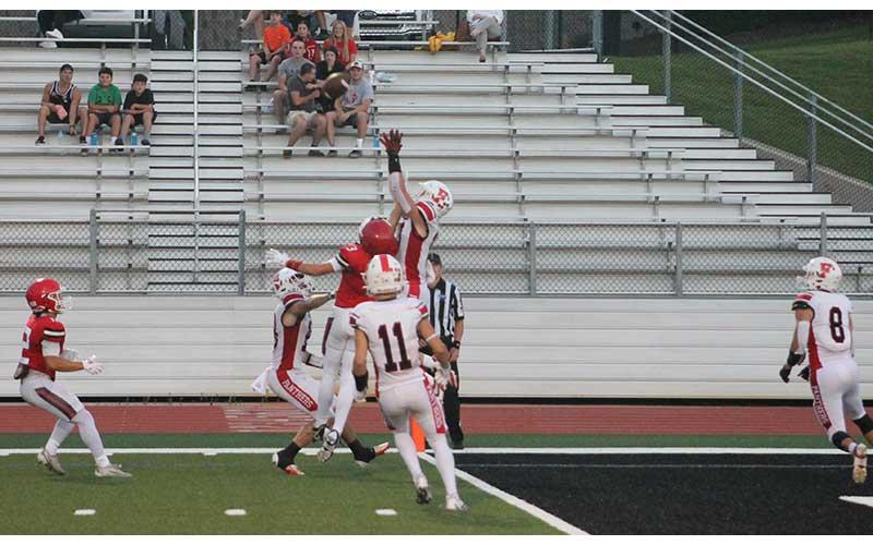 Press photo/Will Woolever - Junior defensive back Lance Parker outleaps a Rabun County Wildcat for a Hail Mary pass in the final seconds of the first half.