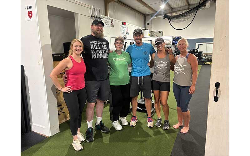 Gale Helix (third from left) is pictured with MoveMore trainers (from left) Lauren Chapman, Jon Lyon, Matt Harlfinger, Melissa Ward and Teresa Ensley.